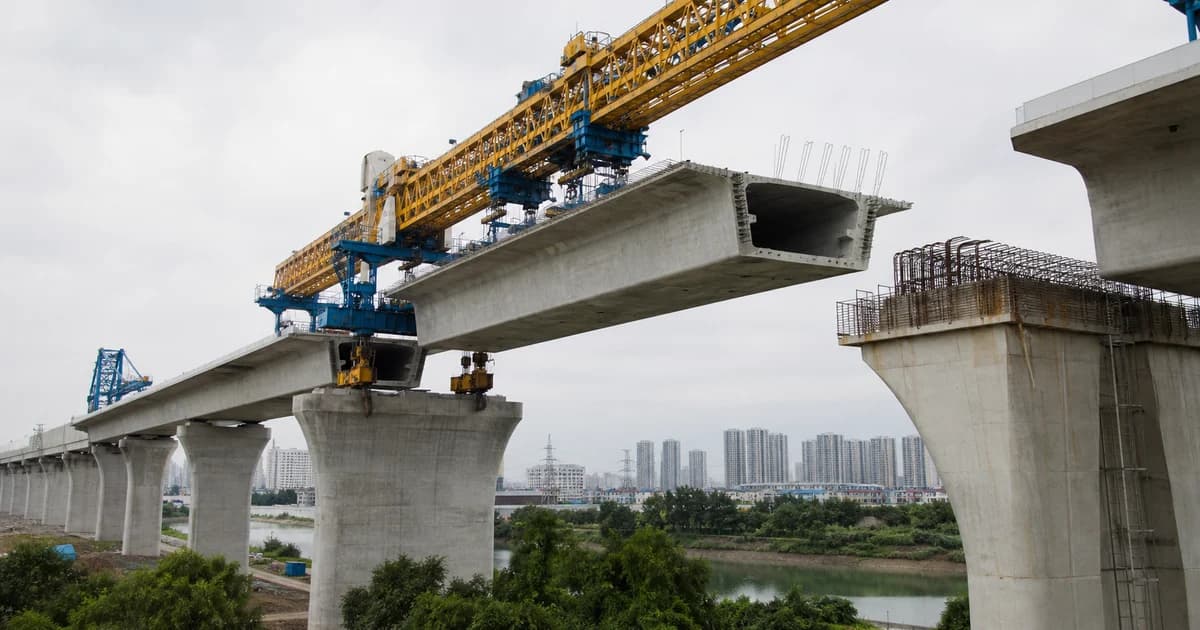 PRECAST.WORLD technical scene of a high-speed railway box girder being placed by a bridge launching machine